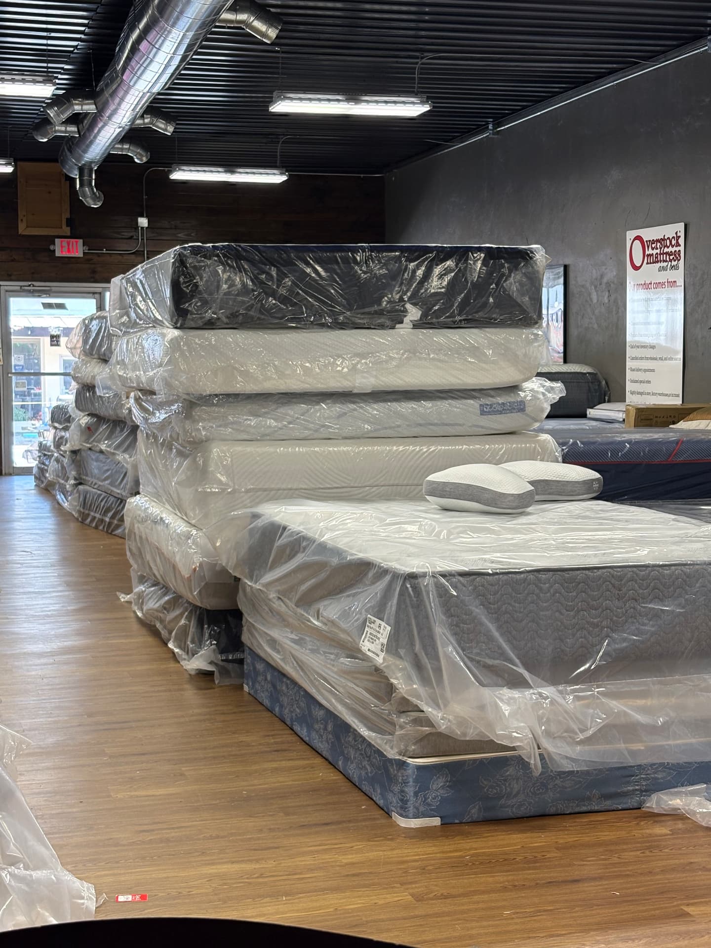 Mattresses on display and stacked in the Leeds showroom